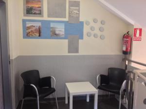 A seating area at Albergue As Eiras