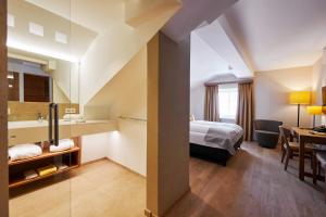 Letto o letti in una camera di Après Post Hotel