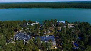 an aerial view of a house on the shore of a lake at Augustów apartament nad jeziorem in Augustów