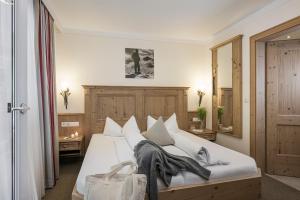 Postel nebo postele na pokoji v ubytování Hotel Lenz