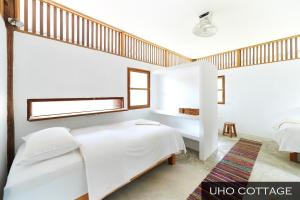 Postel nebo postele na pokoji v ubytování resort hoshihana