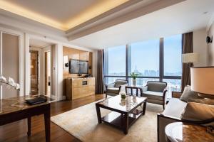 a living room with a couch and a table at The Ritz-Carlton, Chengdu in Chengdu