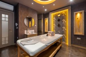 a bedroom with a large bed and a sink at Limak Eurasia Luxury Hotel in Istanbul