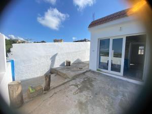 a view of a white building with a window at Dar Ribeh in Rirane