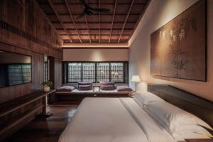 Postel nebo postele na pokoji v ubytování Hangzhou West Lake Anyu Hotel