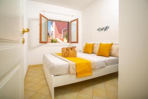 Ένα ή περισσότερα κρεβάτια σε δωμάτιο στο BILANCIA'S HOUSE III 30'Porto cervo & SEA VIEW