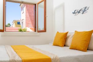 Ένα ή περισσότερα κρεβάτια σε δωμάτιο στο BILANCIA'S HOUSE III 30'Porto cervo & SEA VIEW