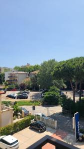a parking lot with cars parked in a parking lot at Onda Blu in Rimini