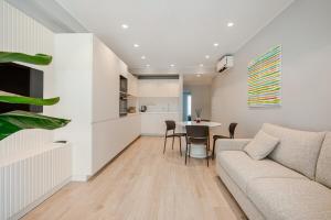 a living room with a couch and a table at Argiro Apartment by Palazzo Zippitelli in Bari