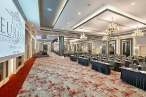 a large banquet hall with chairs and tables at Limak Eurasia Luxury Hotel in Istanbul +37 photos