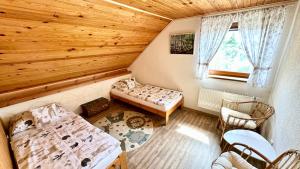 Postel nebo postele na pokoji v ubytování Apartmán Domanín 124