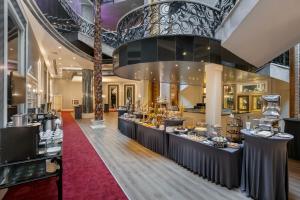 a lobby of a hotel with a dessert counter at Limak Eurasia Luxury Hotel in Istanbul