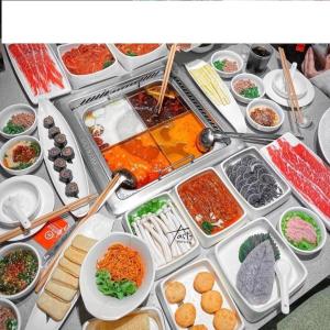 a table filled with different types of food at Tami Homes - Vinhomes D'Capitale Executive Apartment in Hanoi