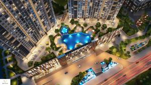 an aerial view of a building with a swimming pool at Tami Homes - Vinhomes D'Capitale Executive Apartment in Hanoi
