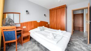 Posteľ alebo postele v izbe v ubytovaní Apartamenty Sun & Snow w Rezydencji Bielik