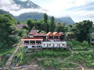 an aerial view of a house on a hill at Phetdavanh Guesthouse in Ban Ngoy-Nua