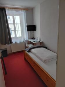 Postel nebo postele na pokoji v ubytování Hotel Blaue Blume