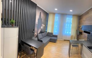 a living room with a couch and a table at Holec Apartments in Prague +131 photos