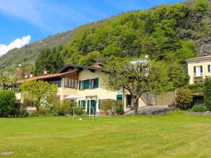 a house in front of a mountain at Vento Blu in Domaso