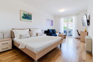 Postel nebo postele na pokoji v ubytování Villa Kogo + 37 fotografií