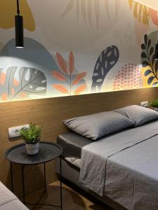 Postel nebo postele na pokoji v ubytování Bloom Boutique Hotel