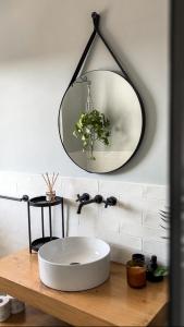 a bathroom with a white sink and a mirror at Sea view & Countryside apartment in Manikata in Manikata +11 photos