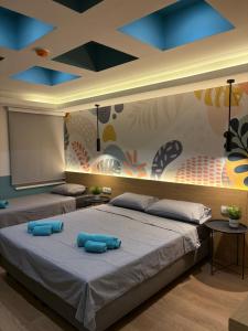 Postel nebo postele na pokoji v ubytování Bloom Boutique Hotel