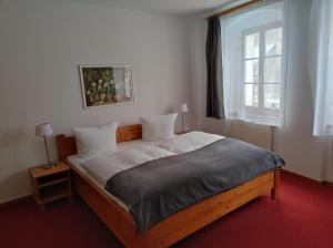 Postel nebo postele na pokoji v ubytování Hotel Blaue Blume