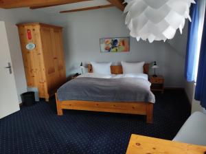 Postel nebo postele na pokoji v ubytování Hotel Blaue Blume