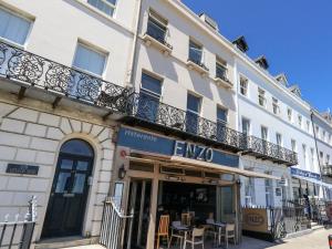 a building with a balcony on top of it at Vista Mare 1 in Weymouth