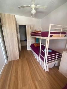 a bedroom with two bunk beds in a room at Playa Rompido in Huelva