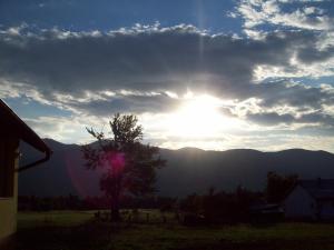 a view of the sun setting over the mountains at House Mara in Korenica