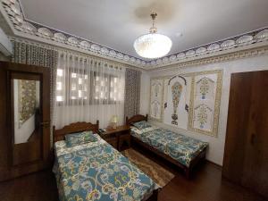 Кровать или кровати в номере Hotel Gulnaraxanum Boutique This hotel is nearby the center of the old city Every room decorated in the unique style
