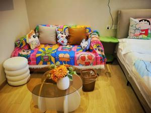 Postel nebo postele na pokoji v ubytování Suyi Hotel Apartment