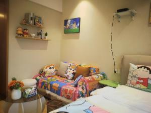 Postel nebo postele na pokoji v ubytování Suyi Hotel Apartment