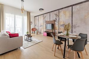 a living room with a table and chairs at A60 Apartment Hotel in Budapest