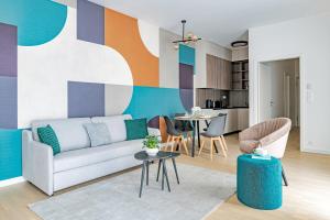 a living room with a couch and a table at A60 Apartment Hotel in Budapest