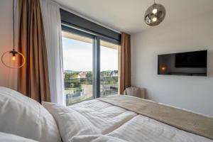 Ένα ή περισσότερα κρεβάτια σε δωμάτιο στο Moderne Villa in Brodarica mit Meerblick & Pool - bei Šibenik +21 φωτογραφίες