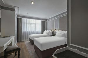 Postel nebo postele na pokoji v ubytování AC Hotel by Marriott Ipoh
