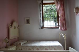 Postel nebo postele na pokoji v ubytování Suite "La Badia"