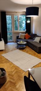 a living room with a couch and a table at Apartament Morze Bałtyckie in Gdańsk