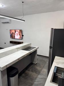 Kuchyň nebo kuchyňský kout v ubytování Apartamentos 31