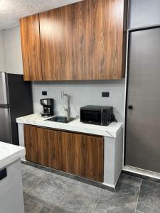 Kuchyň nebo kuchyňský kout v ubytování Apartamentos 31