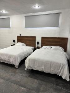 Postel nebo postele na pokoji v ubytování Apartamentos 31