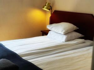 Postel nebo postele na pokoji v ubytování Hotel Örgryte