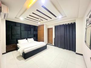 Postel nebo postele na pokoji v ubytování Luxury Apartment Guest House