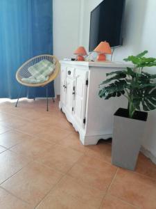 Μια τηλεόραση ή/και κέντρο ψυχαγωγίας στο Holiday Home Terra +6 φωτογραφίες