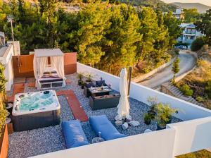 an aerial view of a backyard with a hot tub at Sunny Nest Apartments in Ixia