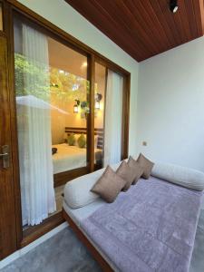 Postel nebo postele na pokoji v ubytování Dhonfalhu Dhigurah