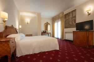 TV a/nebo společenská místnost v ubytování Hotel Stendhal